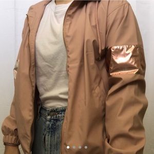 Light pink windbreaker with a hood